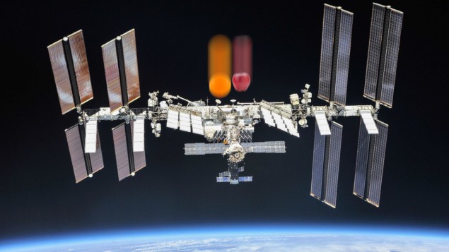 Falling apples and oranges on the ISS Photo of the International Space Station in orbit around the Earth, with a falling apple and orange superimposed on top of it