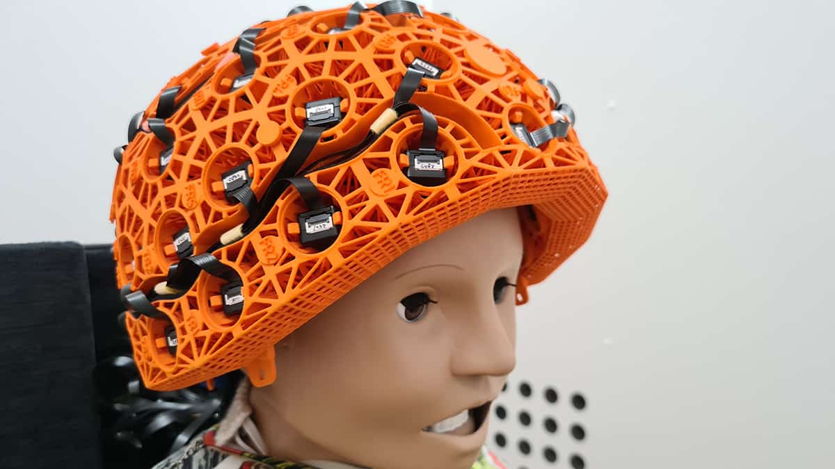 A dummy of a child wearing a magnetoencephalography brain scanner