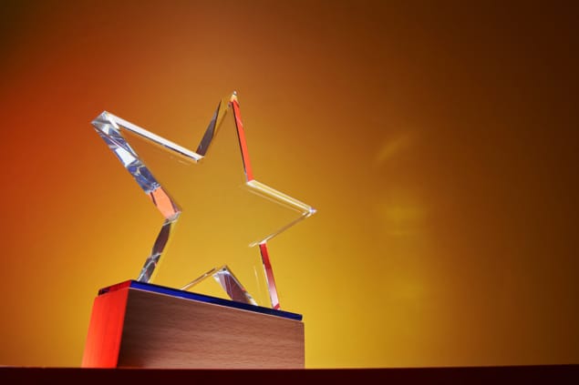 low angle view of star shaped crystal trophy low angle view of star shaped crystal trophy