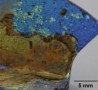 A distinctive iridescent patina on an ancient Roman glass fragment stems from a photonic crystal structure that formed naturally within the material over time